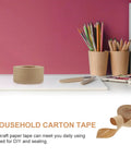 Water Activated Kraft Paper Sealing Tape 4.8 Cm 2 Rolls Waterproof Packaging Tape for carton sealing on desk with pencils.