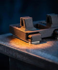 Close-up of 2 Pcs Hands Free Electric Wire Welding Fixture Portable Soldering Jig Tool on metal surface lighting detail.