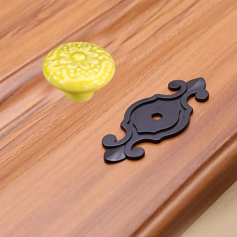 Slick Ceramic Cabinet Knobs And Drawer Pulls With Matte Black Alloy Backplate 10 Pack, yellow flower knob and black plate.