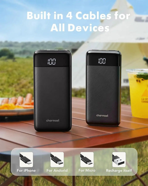 Heavy Duty 10000mAh Power Bank Featuring Reinforced Built In Four Cables For Multi Device Fast Charging And All Day Road Trip Juice To Keep Every Screen Alive on a table outdoors.