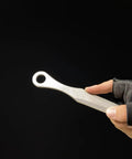 Kunai Inspired Throwing Tool With Full Tang Stainless Steel Build held in gloved hand, showcasing lightweight design.