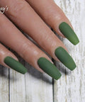 Close-up of hand with Vegan HEMA Free Gel Nail Polish Kale 073 Soak Off UV LED Cure Cruelty Free 10ml applied, green matte finish.