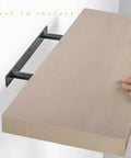 Hands installing a shelf using Size Eight Drywall And Concrete Anchors Kit With Stainless Steel Screws, half-inch anchor diameter.