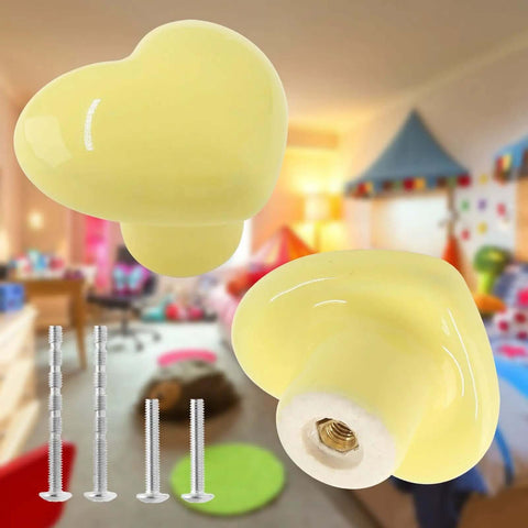 Super Sweet Heart Shape Ceramic Drawer Knobs Yellow Dresser Handles Two Pack Replacement Hardware For Kids Bedroom Cabinet Pulls Rad Slick Furniture Decor Set, close-up view with screws.
