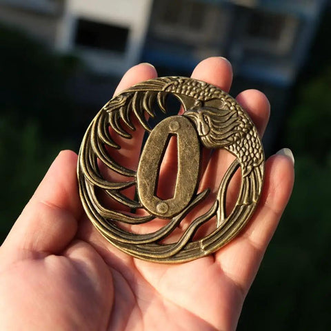 Hand holding Hand Forged Alloy Katana Tsuba Guard With Aquatic Pattern 3.2 Inch Authentic Iaido Accessory for Samurai Swords