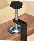 Close-up of a rattan furniture clamp displaying the metal screw and black handle, part of the Rattan Furniture Clamp 2 Pack For Patio And Sectional Sofas, Wicker Chair Fasteners Easy Install Outdoor Sofa Clips To Secure And Stabilize Your Sectional Couch, Perfect For Outdoor Lounge Sets.