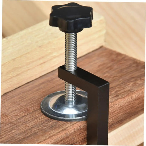 Close-up of a rattan furniture clamp displaying the metal screw and black handle, part of the Rattan Furniture Clamp 2 Pack For Patio And Sectional Sofas, Wicker Chair Fasteners Easy Install Outdoor Sofa Clips To Secure And Stabilize Your Sectional Couch, Perfect For Outdoor Lounge Sets.