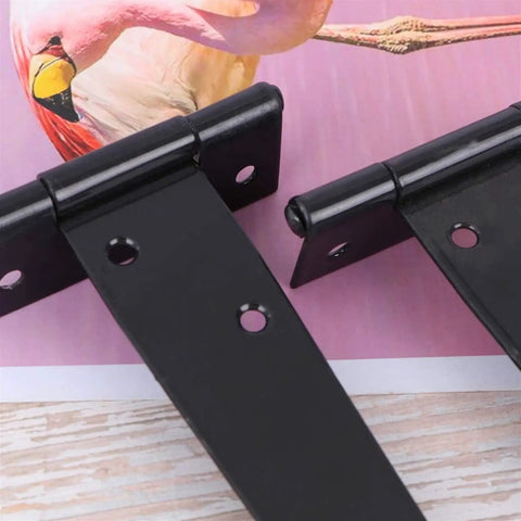 Tough As Nails T Shape Triangular Door Hinge with six holes on a pink background, designed for heavy duty use.