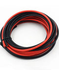 Top Shelf 14 Gauge Silicone Electrical Wire Cable Bundle Packed With Mean Tinned Copper Core That Bends Like Butter Takes On Brutal Heat Sweet For Custom Rides And Garage Builds, red and black cables coiled.