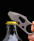 Dope Everyday Carry Multi Tool Keychain With Pry Bar Bottle Opener And Wrench For Men shown opening a bottle cap