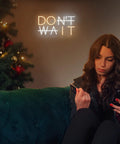 Don't Wait LED Neon Sign Wall Decor Do It Neon Light USB Powered Adjustable Brightness in living room with woman on couch