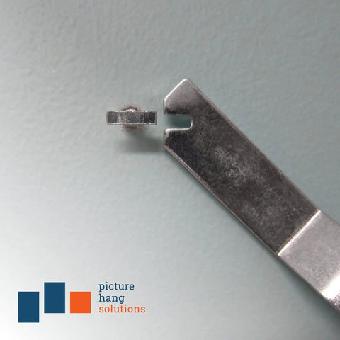 Close-up of Hella Durable T Head Security Wrench For Picture Frame Installation With Tough Steel Build for inserting locking screws.