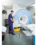 Professional Grade 58 Inch Yellow Quick Connect Straight Mop Handle For Industrial Janitorial Floors being used in a healthcare setting.