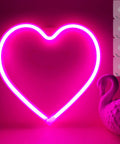 Pink Neon Heart LED Light For Bedroom Or Living Room USB Or Battery Operated Mood Lamp With Four Hooks displayed on wall
