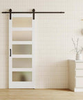 Glass And Wood Barn Door Kit 30In X 84In With Frosted Five-Panel Glass, white primed MDF panel installed in living room.