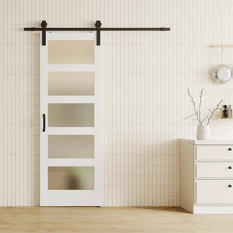Glass And Wood Barn Door Kit 30In X 84In With Frosted Five-Panel Glass, white primed MDF panel installed in living room.