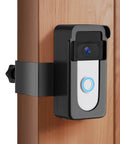 Anti-Theft Doorbell Camera Mount No-Drill For Battery Doorbells Compatible With 2nd Gen 2020 2024 Release Plus Pro Models And 1st Through 4th Generations For Homes And Rentals Keeps Full Motion Alerts And Night Vision Unblocked mounted on a wooden door.