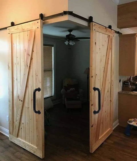 Wooden sliding barn doors with black handles in living room, featuring Matte Black 12 Inch Wall Mount Stair Handrail 1.3 Inch Metal Pipe Grab Bar