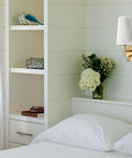 Set Of Two Modern Brass Gold Wall Sconces With Fabric Shade And USB Rechargeable Lights in bedroom with white linen shade