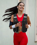 Runner wearing a lightweight hydration vest for runners with adjustable chest straps, stable bladder, breathable mesh, and quick refill access