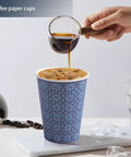 Pouring coffee into 240 Pack 12 Oz Disposable Paper Cups Navy Floral Hot And Cold Bev Cups For Home Office Restaurant And Events Leak Proof
