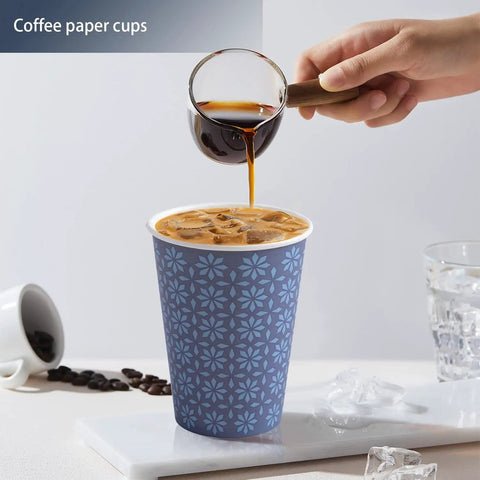 Pouring coffee into 240 Pack 12 Oz Disposable Paper Cups Navy Floral Hot And Cold Bev Cups For Home Office Restaurant And Events Leak Proof