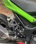 Upgrade Your Ride With These Heavy Duty Exhaust Hanger Muffler Bracket Kit Made For Kawasaki Ninja250 And Ninja300 Models From 2013 To 2018 Featuring Thick Iron Build Superior Durability Plus That Sweet Black Finish Youve Been Searching For Today. Black iron exhaust hanger bracket kit mounted on Kawasaki Ninja 250/300 rear frame and muffler