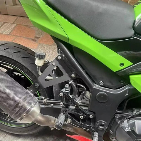 Upgrade Your Ride With These Heavy Duty Exhaust Hanger Muffler Bracket Kit Made For Kawasaki Ninja250 And Ninja300 Models From 2013 To 2018 Featuring Thick Iron Build Superior Durability Plus That Sweet Black Finish Youve Been Searching For Today. Black iron exhaust hanger bracket kit mounted on Kawasaki Ninja 250/300 rear frame and muffler