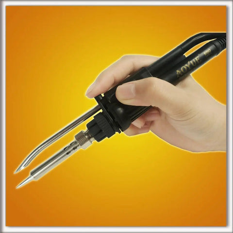 Hand holding 4 In 1 Digital Hot Air Rework And Soldering Station With 70W Soldering Iron, Vacuum Pickup And Smoke Absorber