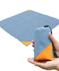 Pocket Picnic Blanket For Grab And Go Outdoor Fun That Folds Small And Lightweight Sandproof 55 By 60 Inch Beach Mat in hand