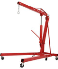 Grind House 2 Ton Folding Engine Hoist Forged From Beefy Carbon Steel With Six Greaseproof Rollers For Dead Simple Hydraulic Lifting Of Car Engines Or Axles Without Breaking A Sweat, showcasing a red hoist with wheels.