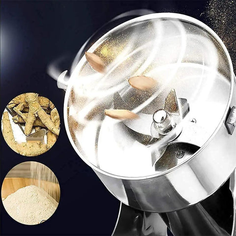 Close-up of Electric Grain Mill Grinder For Home Use, grinding seeds with transparent lid, heavy duty stainless steel 3 blade system