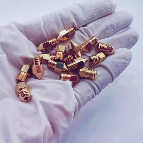 16Pcs 0.4mm MK8 Brass Ender 3 Nozzle Set For 3D Printers Including Ender 3 V2 Pro Max S1 Neo CR10 Series, Durable shown in gloved hand