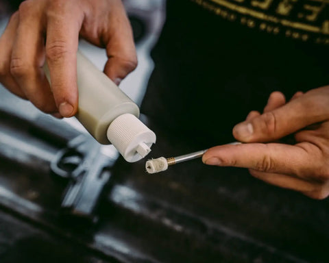 Applying oil on Felt Cleaning Pellets for 22 Caliber With Jag for gun maintenance