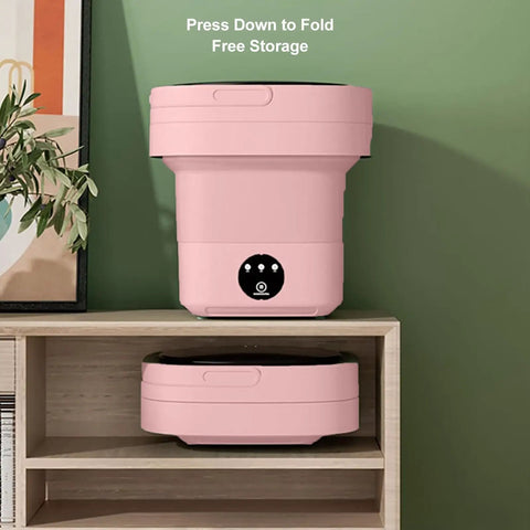 Compact Foldable Mini Washer With 6.5L Drum, Quick Spin Motor For Hassle Free Laundry, pink washer displayed in folded position on shelf.