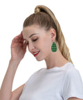 Totally Fire Green Grid Teardrop Faux Leather Dangle Earrings With Silver Plated Hooks worn by a model with a ponytail.