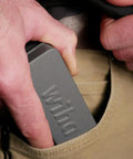 Killer Quality 32 Piece Impact Bit Set With Compact Mini Ratchet held in hand, fitting into pocket for easy carry.