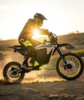 Rider on 3500W Peak Electric Dirt Bike for Teens and Adults, Gnarly Off Road E Bike, sandy trail, sunset backdrop, dual suspension