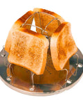 Stovetop Camping Toaster 4 Slice For Gas Stove with toasted bread on stainless steel rack, ideal outdoor cooking gear