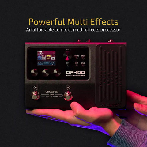 Hands holding GP 100 Guitar And Bass Amp Modeling Rig With IR Cabinets, 140 Built In Effects, 45 Amp Models, on display