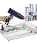 Heavy Duty Manual Shrink Wrap Machine With Heat Sealing And Cutting Functions in use, featuring heat gun and packaging materials.