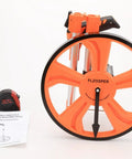 Go-To Measuring Wheel Portable Three Fold 13 Inch Wheel For Distance And Surveying Measures Up To 9,999.9 Feet Durable ABS Body With Wear Resistant Rubber Handy Orange, folded view with tape measure and manual