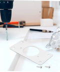 Stainless Steel Hinge Repair Plate Kit, 50 Pcs For Cupboard And Cabinet Doors, shown with drill and screws on workbench.