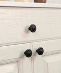 Matte Black Dope Round Cabinet Knobs Set of Fifteen for Cabinets and Drawers, 36mm Diameter Flower Shape in use on white drawers
