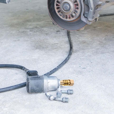 Copper Gasket Washers Kit For Automotive Plug Fittings near car brake disc and pneumatic tool on concrete floor