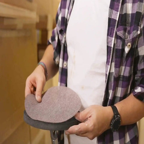 Person holding 9 Inch Disk Abrasive Sanding Net Disc 240 Grit, showing open weave texture for dust-free sanders.