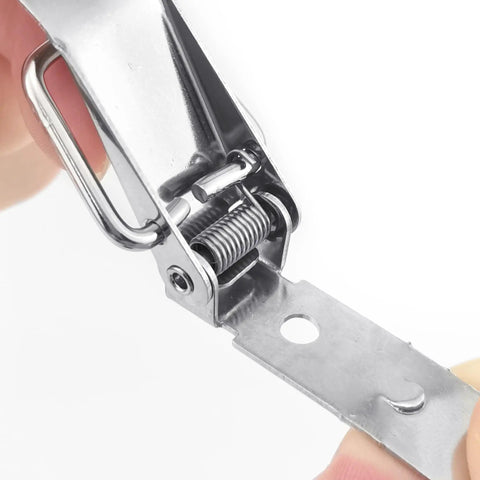 Close-up of spring mechanism on spring loaded toggle latches with screws 73 mm stainless steel silver small clamp clips.