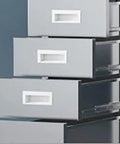 Kickass Heavy Duty Stainless Steel Workbench Setup For Office Or Commercial Kitchen Prep Station With Leveling Feet And Rust Proof Coating That Is Seriously Built To Last Without Any Of The Typical Headaches close-up of gray drawers in a modern cabinet.