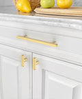 Gold Cabinet Pulls 5 Inch Center To Center 6.4 Inch Overall Length Brushed Gold Drawer Hardware installed on white cabinets