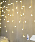 Fairy Curtain Lights USB Powered And Battery Operated 13ft 96 LED Globe Icicle String creating warm white ambience in room